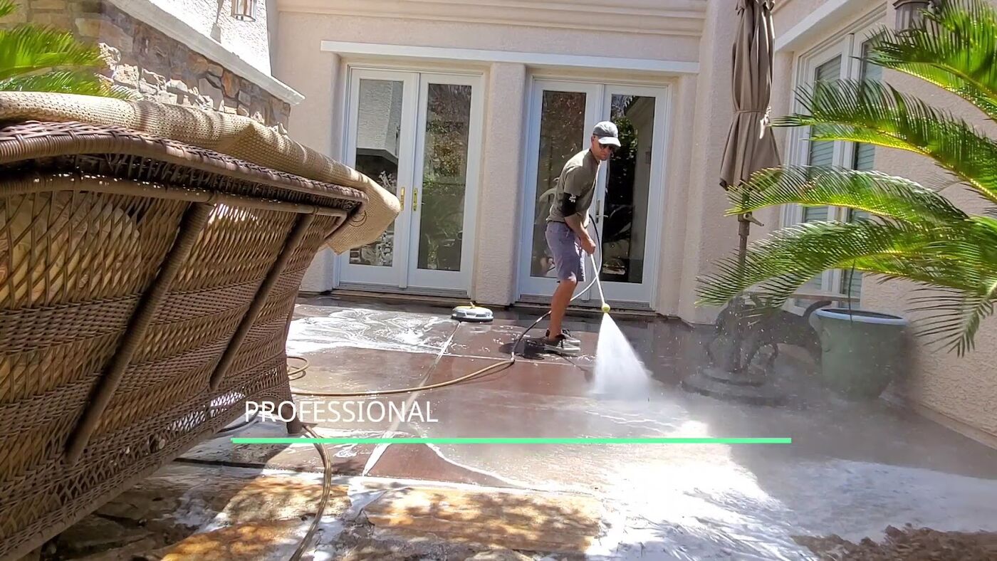 Pressure washing a patio surface at a Las Vegas home