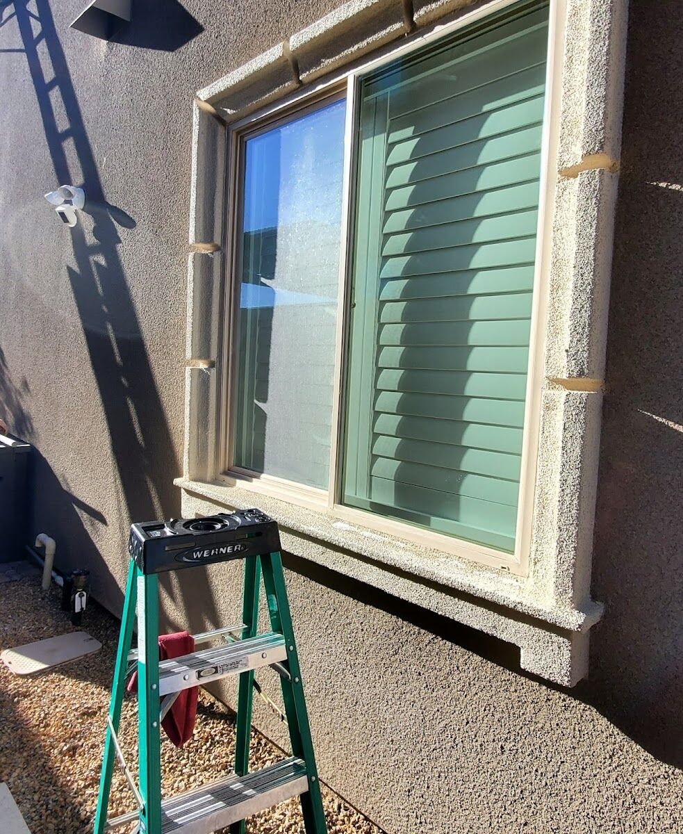 Ladder set for exterior window cleaning on a Las Vegas home